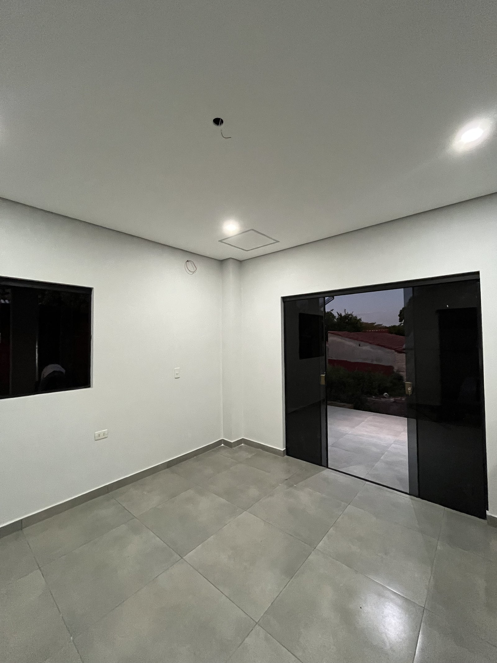 Ambiente interior con television, vivienda Mile San Lorenzo - OGA Constructora